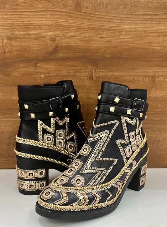 Hand embroidered black boots with intricate handwork